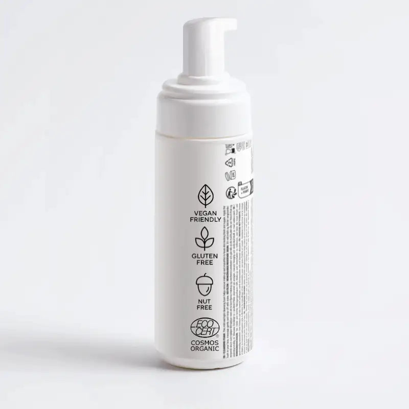 Baksida av SKINØ Foaming Cleanser med symboler för ECOCERT, Vegan och Nut Free – garanterad ren skönhet.